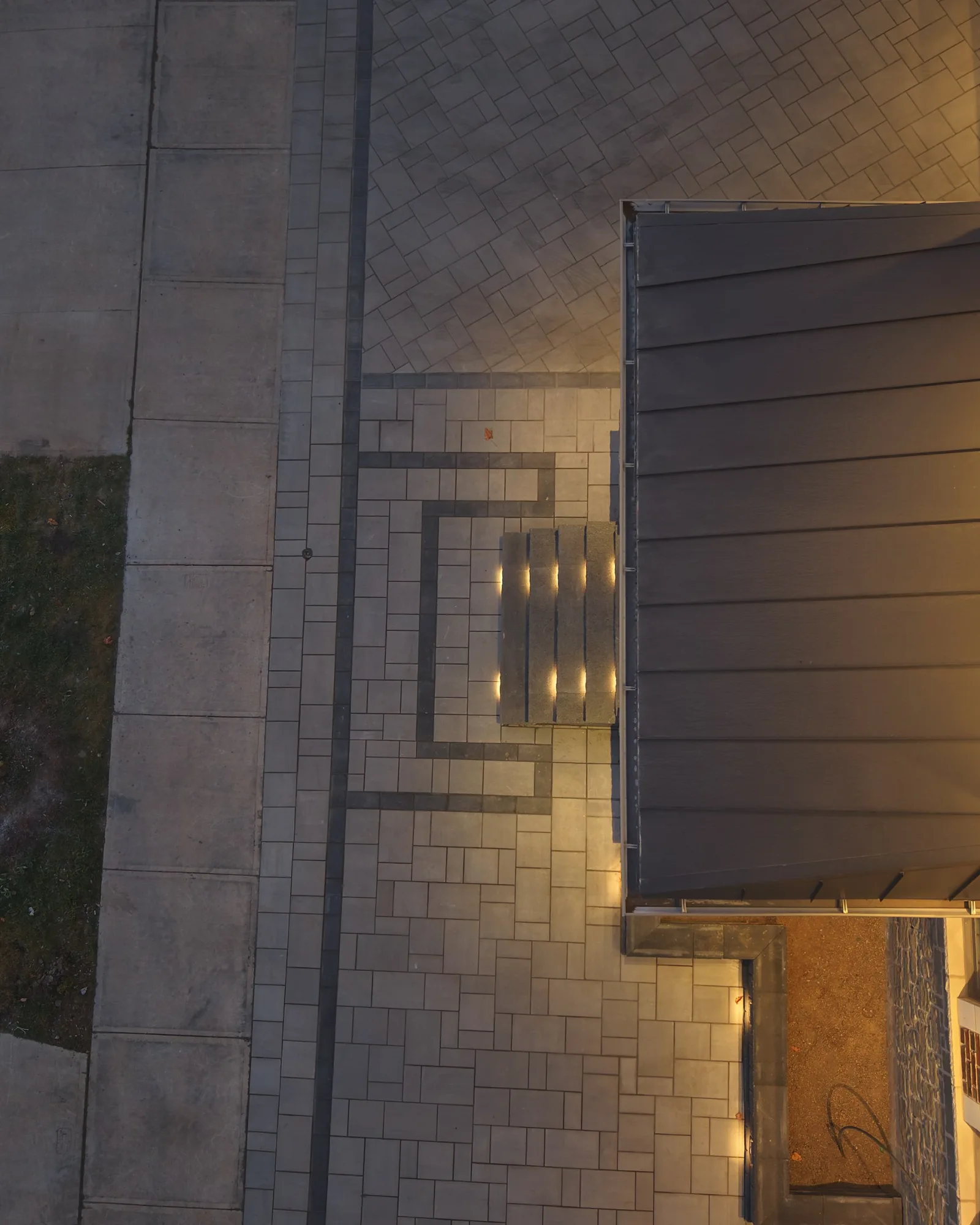Overhead view of the front entrance canopy and surrounding paver pattern